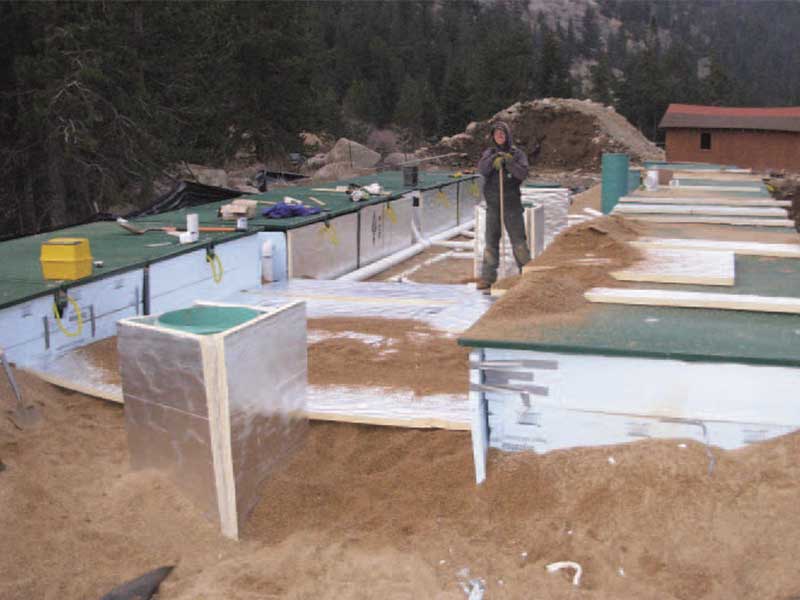 Wastewater treatment pods with protective insulation